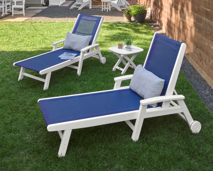 A POLYWOOD Coastal 3 Piece Wheeled Chaise Set features clean Navy Blue sling fabric and a White HDPE lumber frame.